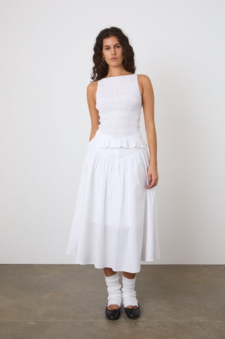 woman wearing white tank top and midi skirt
