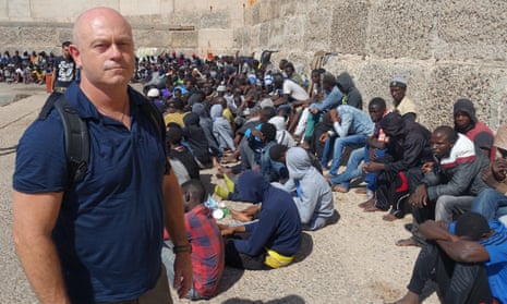 Ross Kemp with migrants back in port