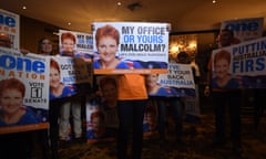 One Nation's Pauline Hanson and supporters hold up her 2016 campaign signs during her election-night function in Ipswich