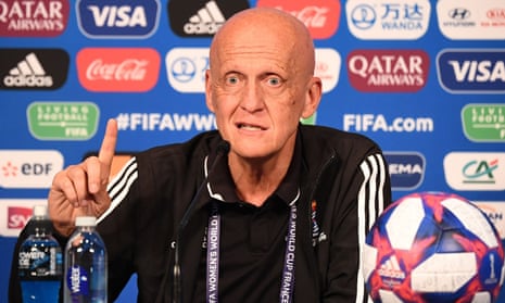 Pierluigi Collina gestures by raising a finger during a press conference in Paris