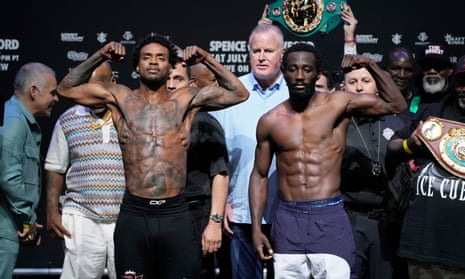 Errol Spence, left, and Terence Crawford pose on Friday after making weight for their forthcoming welterweight title unification fight in Las Vegas.
