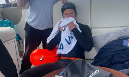 Adam Diver dries off after his swim.