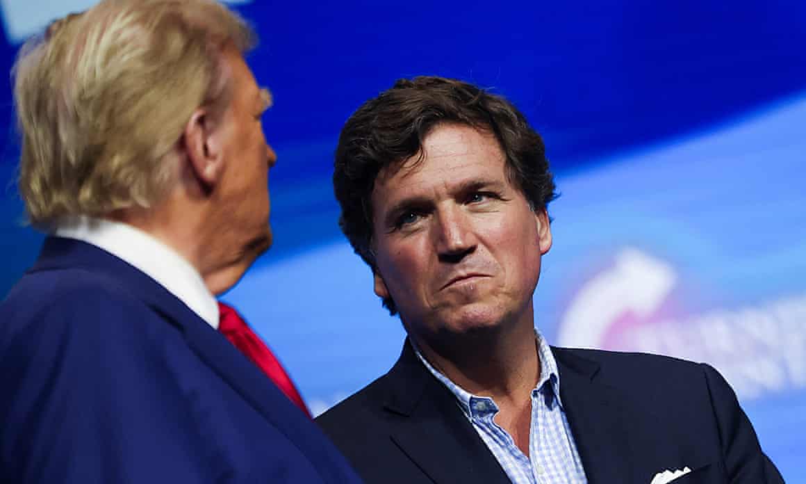 Tucker Carlson with Donald Trump during a campaign event in Duluth, Georgia