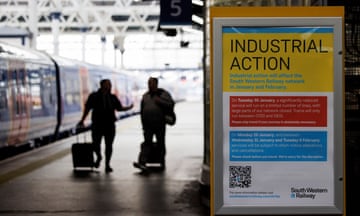 A sign informing passengers about industrial action at Waterloo station in January 2024. 