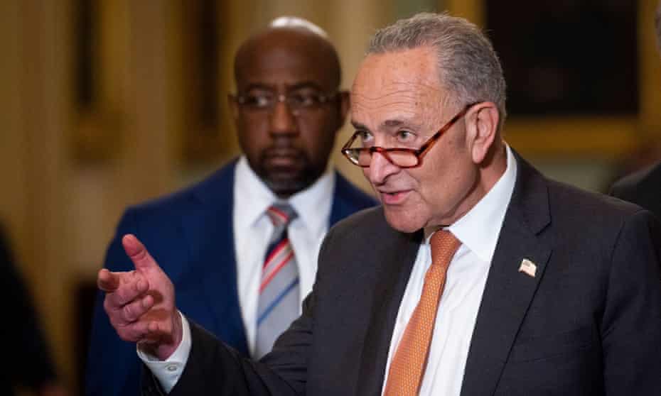 Senator Chuck Schumer, flanked by Senator Raphael Warnock, said the blocking of voting rights legislation by a Republican filibuster was ‘the starting gun, not the finish line’. 