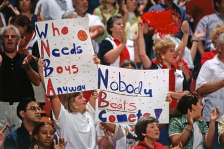 Fans hold up signs saying “Who Needs Boys Anyway” and “Nobody Beats Comets” at a 1997 Houston Comets game.
