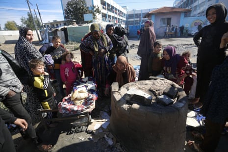 Palestinian families take shelter at a UNRWA school in Deir al-Balah, Gaza.