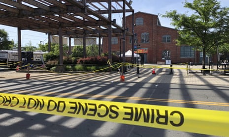 Police crime-scene tape keeps people away from the brick Roebling Wire Works building in Trenton.