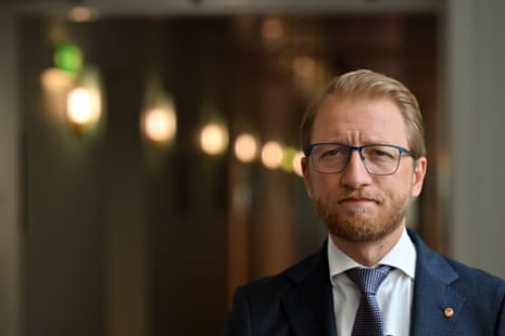 A man with blond hair and glasses.