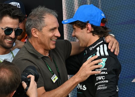Driver Andrea Kimi Antonelli hugs his father Marco, both smiling warmly