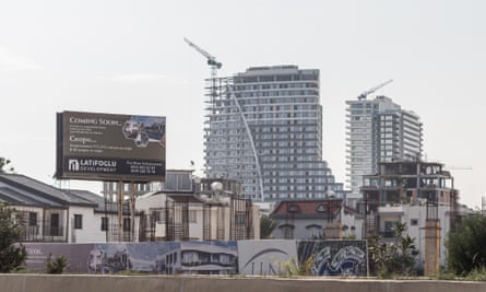 A sign with Russian language advertising apartments with a sea view on a construction site in Iskele/Trikomo in northern Cyprus