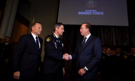 Tony Abbott (left), immigration minister Peter Dutton,(right), congratulate new commissioner of the Australian Border Force, Roman Quaedvlieg. 