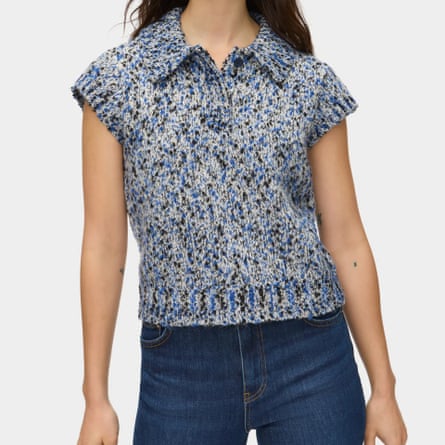 A model wears the Aligne knit polo top. The knit is grey with speckled black and navy