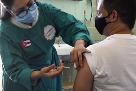 A medical worker administers a dose of Sovereign 2 to a volunteer in Havana.