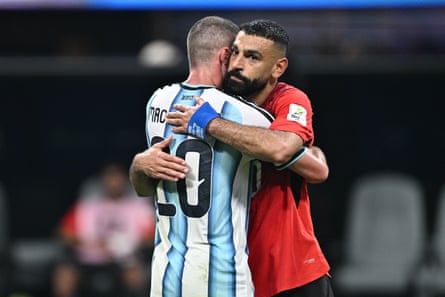 Mohamed Salah hugs his former Liverpool teammate Alexis Mac Allister after Argentina’s victory