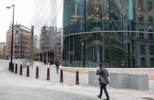 Two people outside Goldman Sachs building