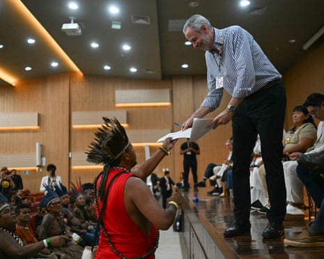 Cop30 President Andre Correa do Lago receiving documents from Indigenous leaders from the Tapajos region during a meeting within the COP30 UN Climate Change Conference, in Belem, Para State, Brazil, on November 14, 2025.