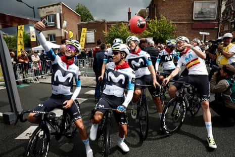 Movistar’s Enric Mas snaps a selfie with teammates before the start of stage three.