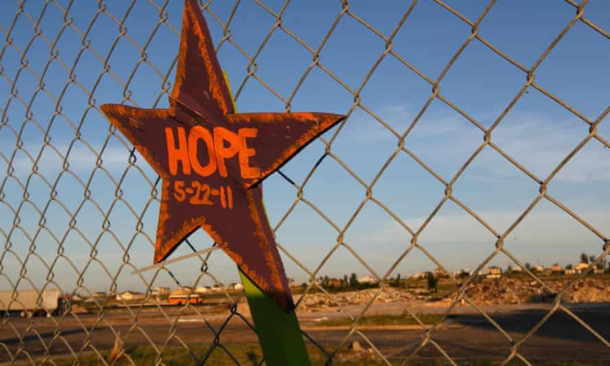 A sign on a fence near the site where Joplin high school once stood.