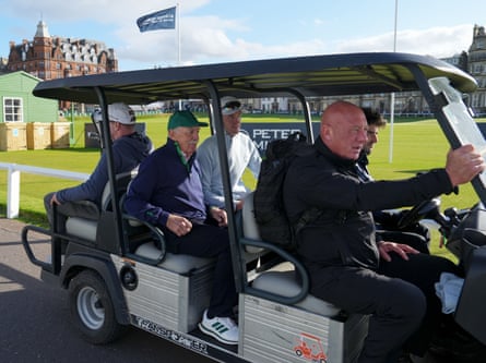Dermot Desmond is driven away from the course after the fans’ protest