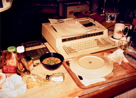 Tap, tap, gulp, gulp … Thompson’s cluttered writing desk. A typical meal might include soup, chutney, peanut butter, salsa, mustard, endive, celery, garlic salt, microwave turkey dinner, Paul Newman’s salad dressing, whiskey, coffee, beer and a cigarette.