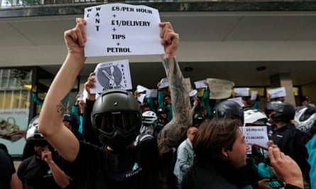 Deliveroo riders protest over pay outside the company HQ in Torrington Place, London, on 11 August 2016.