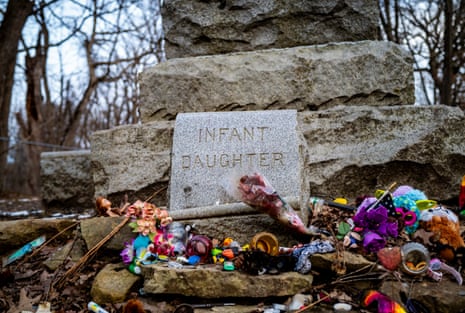Floral tributes for an infant daughter at Batchelor’s Grove Cemetery.