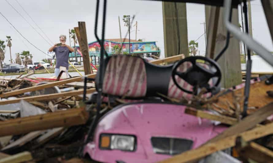 Gary Goerner surveys the damage from Hurricane Nicholas as he walks through his neighborhood in San Luis Pass, Texas.