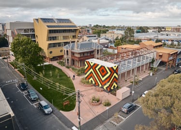 Aerial view of Balam Balam Place, with a geometric patterned building and historic house