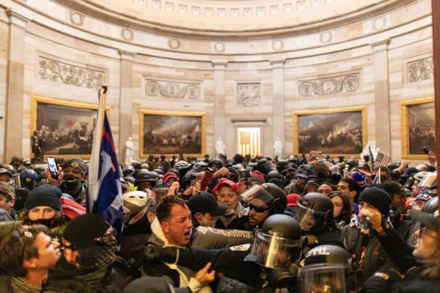 Police intervene against Trump supporters who breached security and entered the Capitol building.