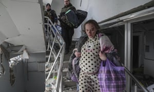 Mariana Vishegirskaya walks down stairs in a maternity hospital damaged by shelling in Mariupol, Ukraine, Wednesday, March 9, 2022.