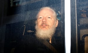 WikiLeaks founder Julian Assange is seen in a police van