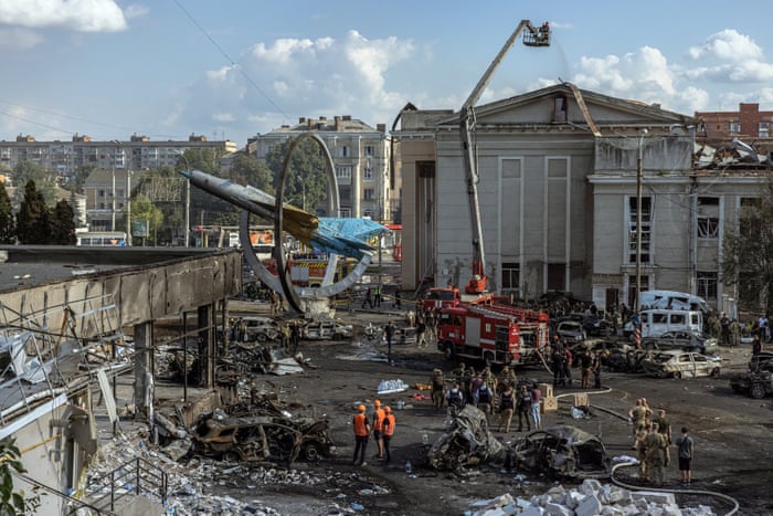 Emergency teams work at the site of a missile strike in Vinnytsia, Ukraine, where at least 23 people, including three children, were killed.