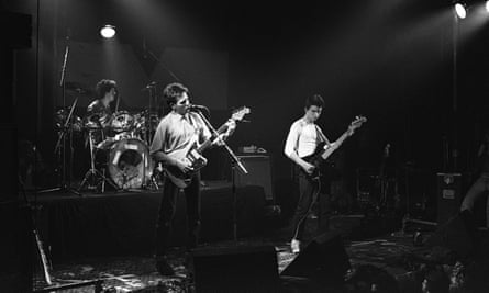 Tolhurst, Robert Smith and Simon Gallup on stage in 1979.