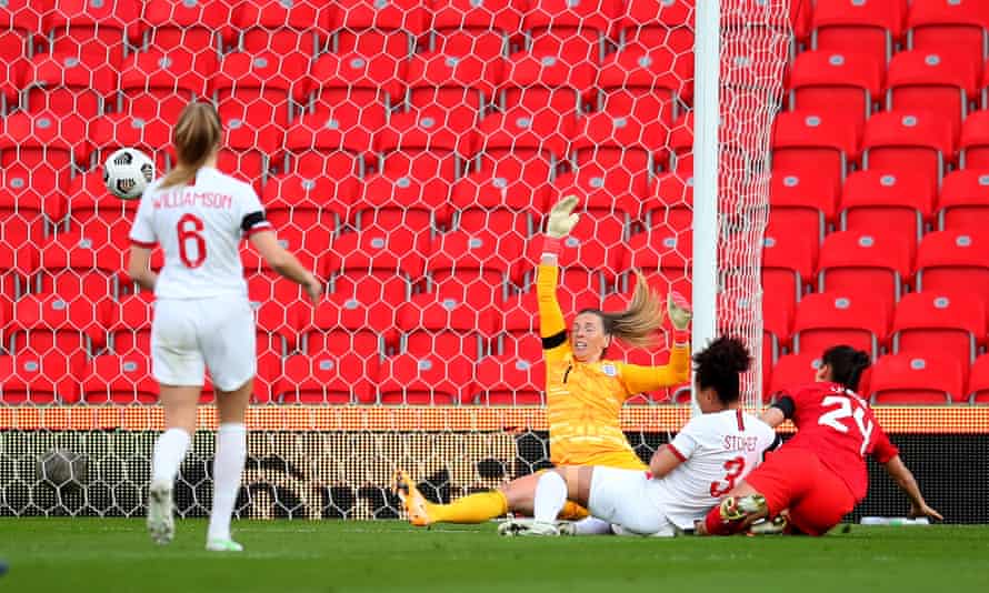 Canada’s Evelyne Viens opens the scoring past Carly Telford of England