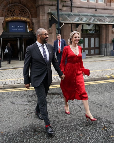 James Cleverly crossing the street hand in hand with his wife Susie, on 2 October 2023