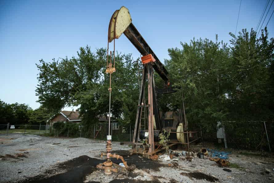 A pump jack rests idle in a residential lot of a lower income neighborhood in Oklahoma City.