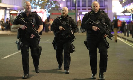 Armed police patrol near Oxford Street on 24 November 24.