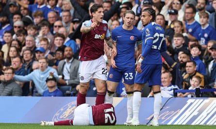 Lucas Digne lies on the turf after a challenge by Chelsea’s Malo Gusto that led to a red card.