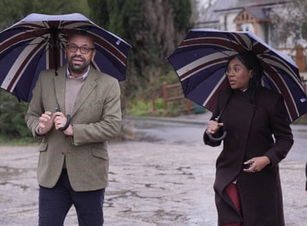 Cleverly and Badenoch carrying union jack umbrellas