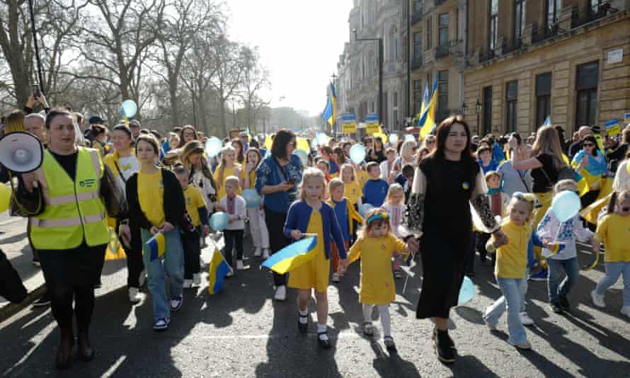 Ukrainian mothers and children lead the “London Stands With Ukraine” March.