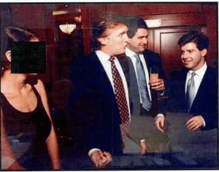 three men and woman with black box over face