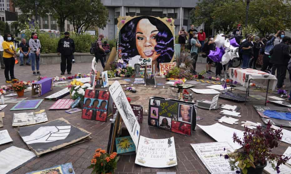 People gather in Jefferson Square in Louisville to await word on charges against police officers in the death of Breonna Taylor.