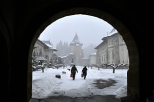 Locals leave after a Romanian Orthodox mass in the Church at Putna Monastery, which is housing people fleeing Ukraine amid Russia’s invasion, in Putna, Romania, 8 March