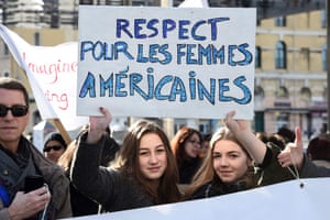 Protesters hold a placard reading ‘Respect for American women’ in Marseille, France