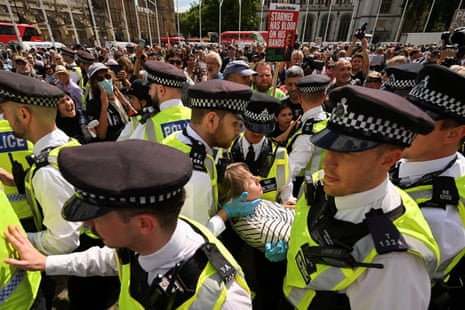 Protester challenging the British government's proscription of Palestine Action demonstrate in London on 9 August 2025.