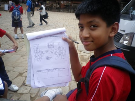 A student from Rato Bangala school in Nepal uses field papers to navigate for the first time. The participants in the exercise were mapping temples around Bhaktapur Durbar Square.