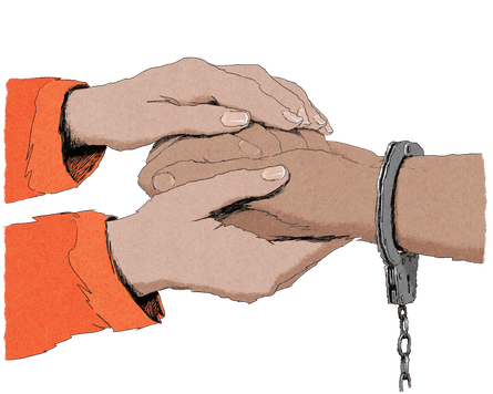 A close-up of two hands holding the hand of a handcuffed detainee.
