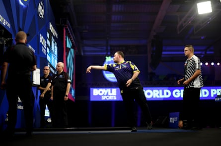Luke Littler throws against Gian van Veen at the World Grand Prix in Leicester