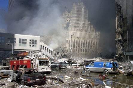 Fire trucks sit amid the rubble near the base of the destroyed World Trade Center